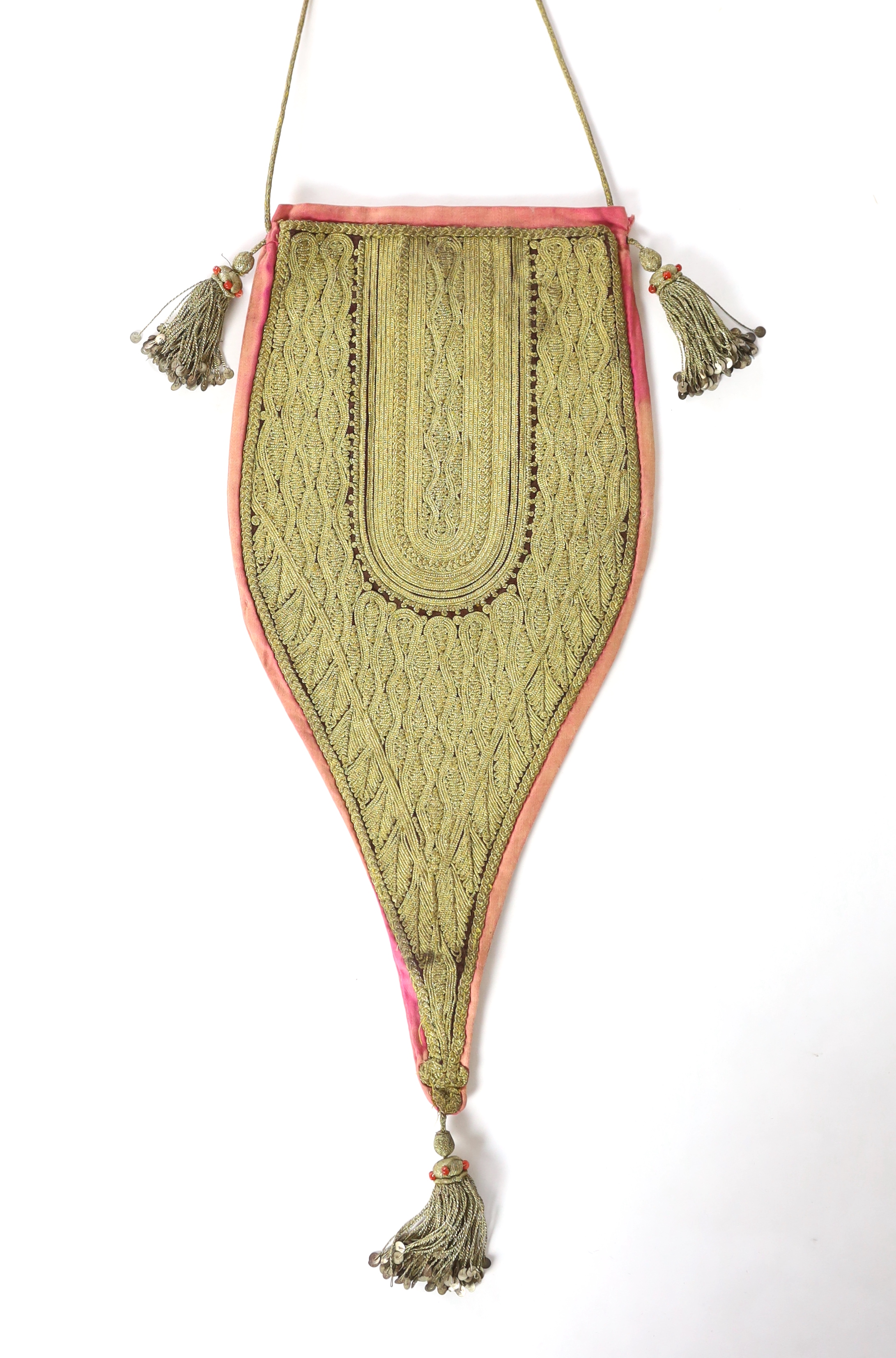 A heavily worked gold thread bag, probably Ottoman, 19th/20th century, with tassels and sequin and coral bead ornamentation, 38cm to end of tassel at base, 60cm strap / cord to end of tassel